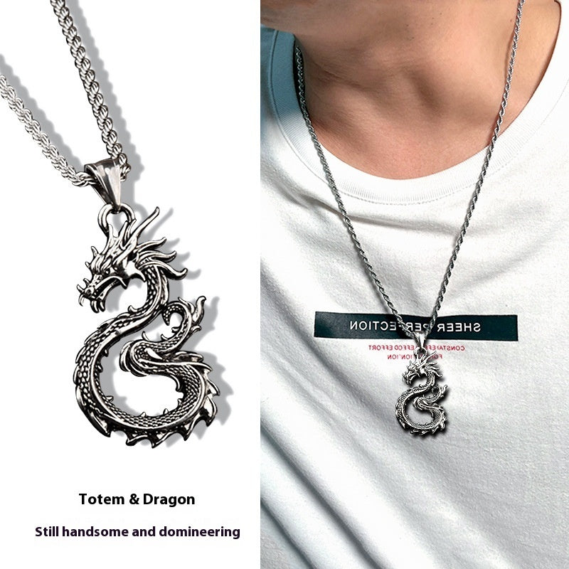 Dragon necklace on a white shirt with 'Sheer Ever Collection' label