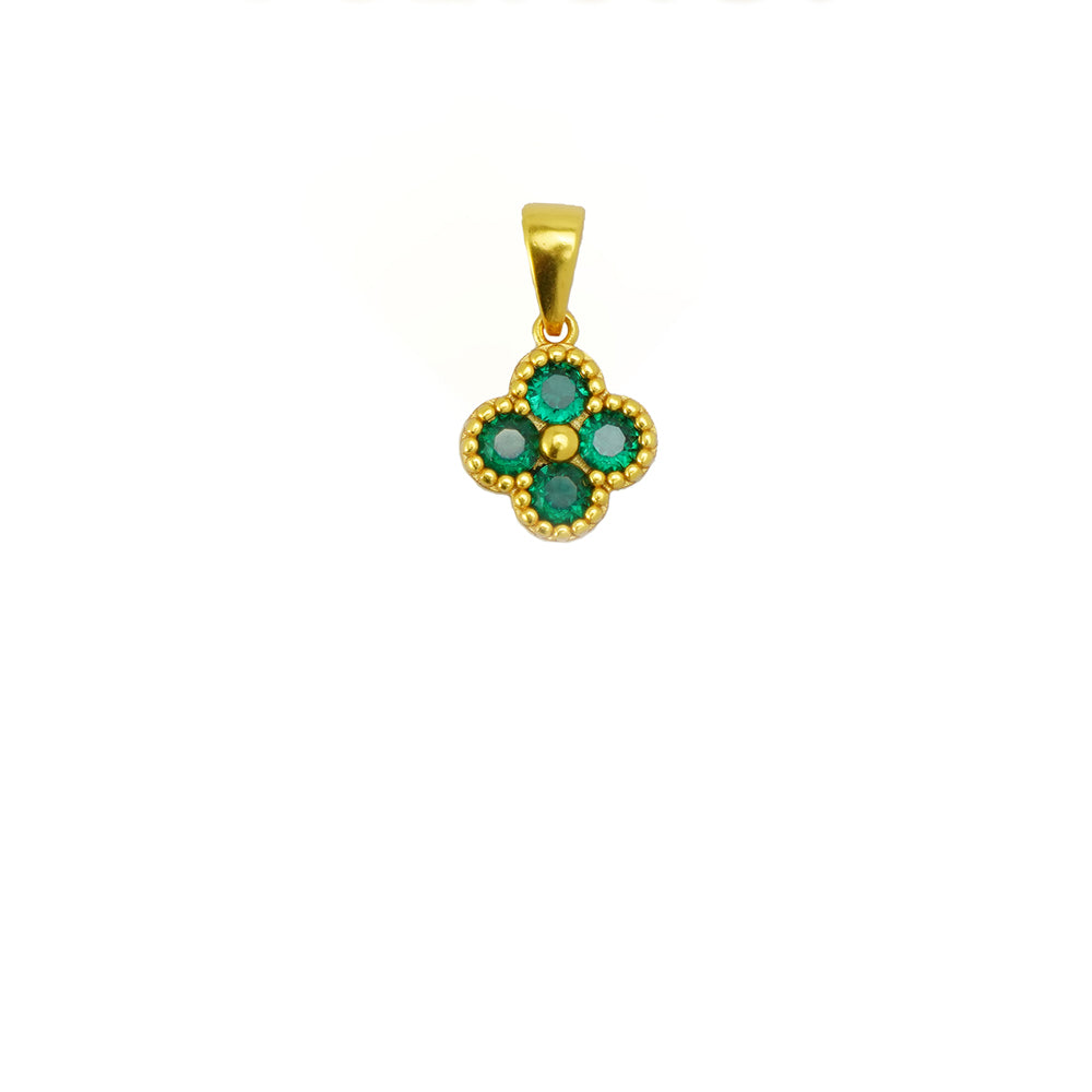 Gold pendant with green gemstones on a white background