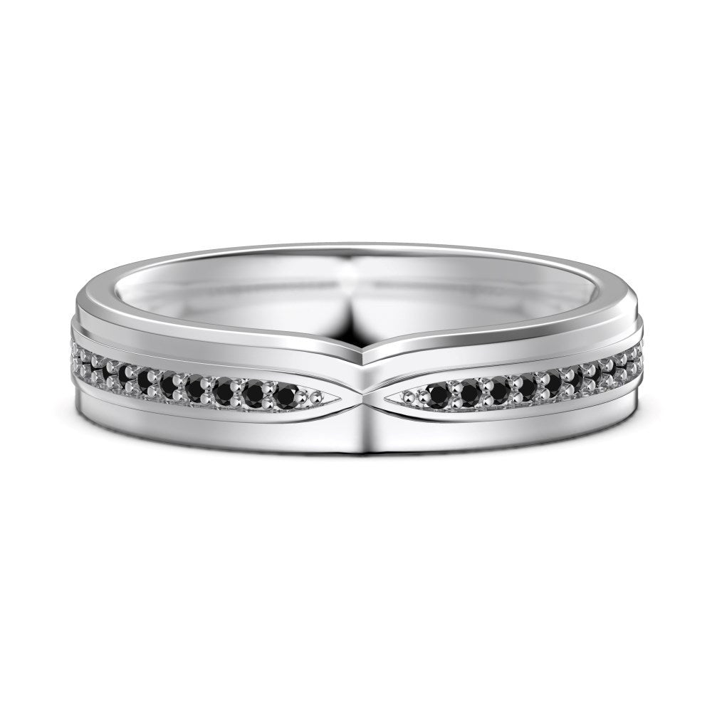 Silver ring with black gemstones on a white background
