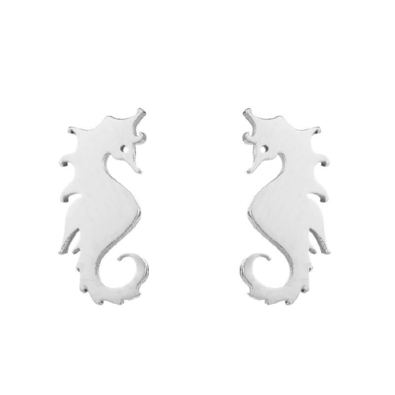 Silver seahorse-shaped earrings on a white background