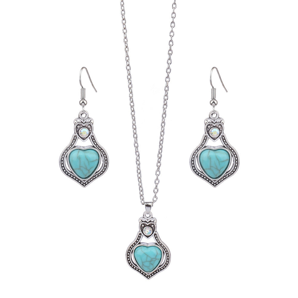 Jewelry set with heart-shaped turquoise stones on a white background