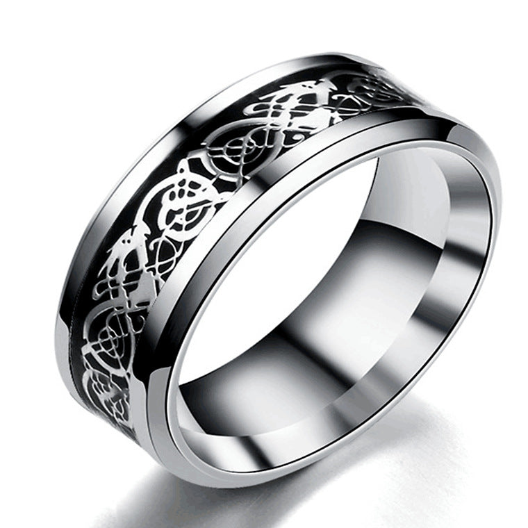 Silver ring with intricate design on a white background
