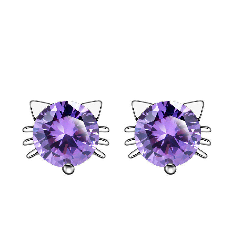 Pair of purple gemstone earrings with cat ear design on a white background