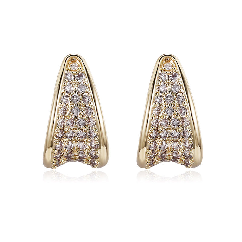 Gold earrings with diamond accents on a white background