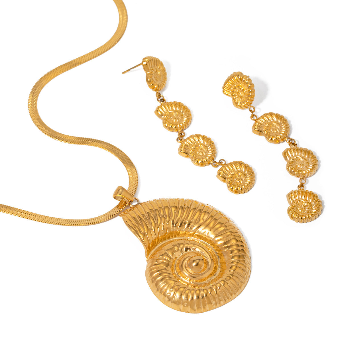 Gold necklace and earrings set on a white background