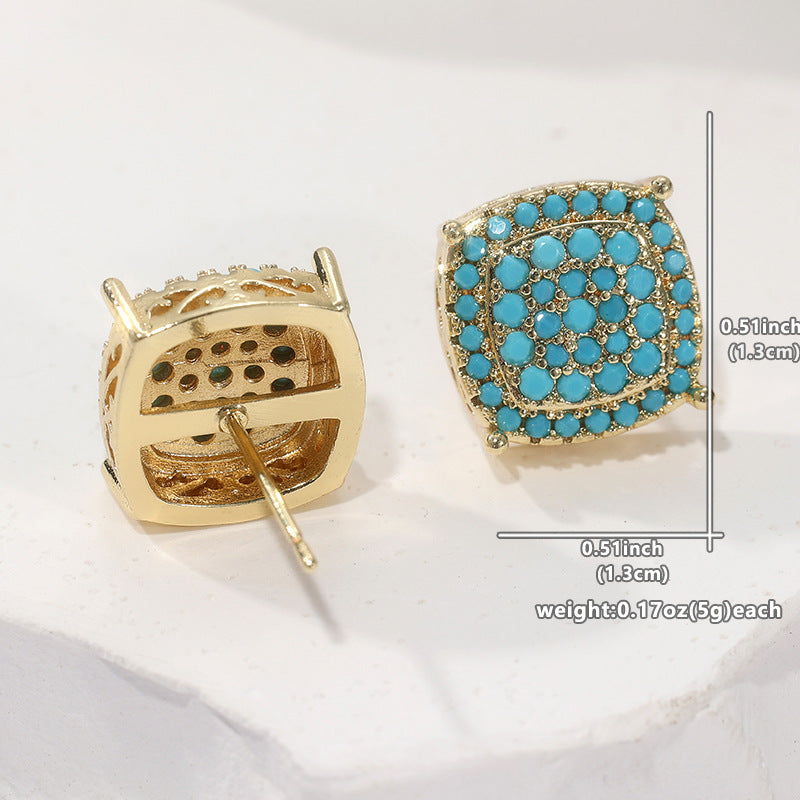 A pair of square stud earrings shown on a white surface, one from the front with turquoise-blue stones in a gold setting and one from the back showing the gold post and backing. Measurement annotations are overlaid on the right side.