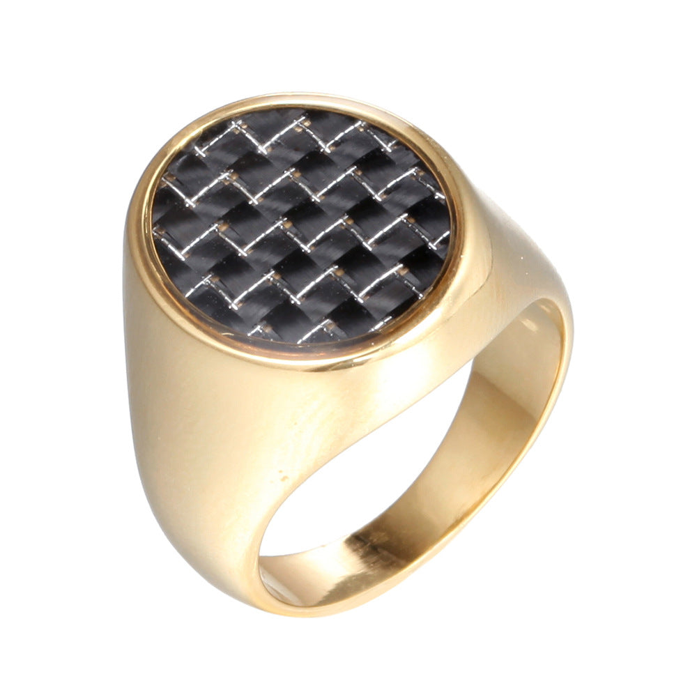 Gold ring with a black woven center on a white background
