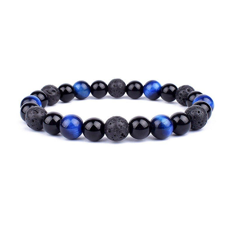 Beaded bracelet with black and blue beads on a white background