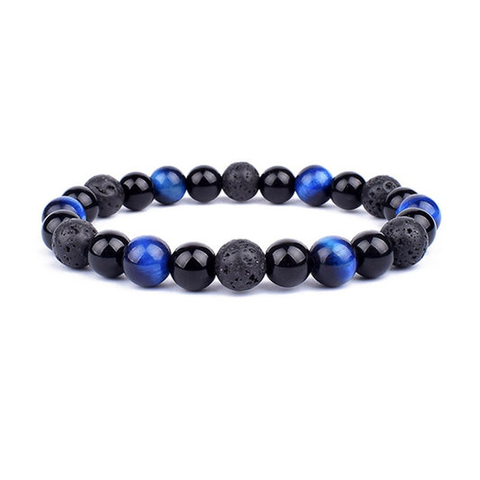 Beaded bracelet with black and blue beads on a white background