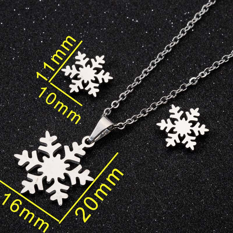 Snowflake pendant necklace with measurements on a black background