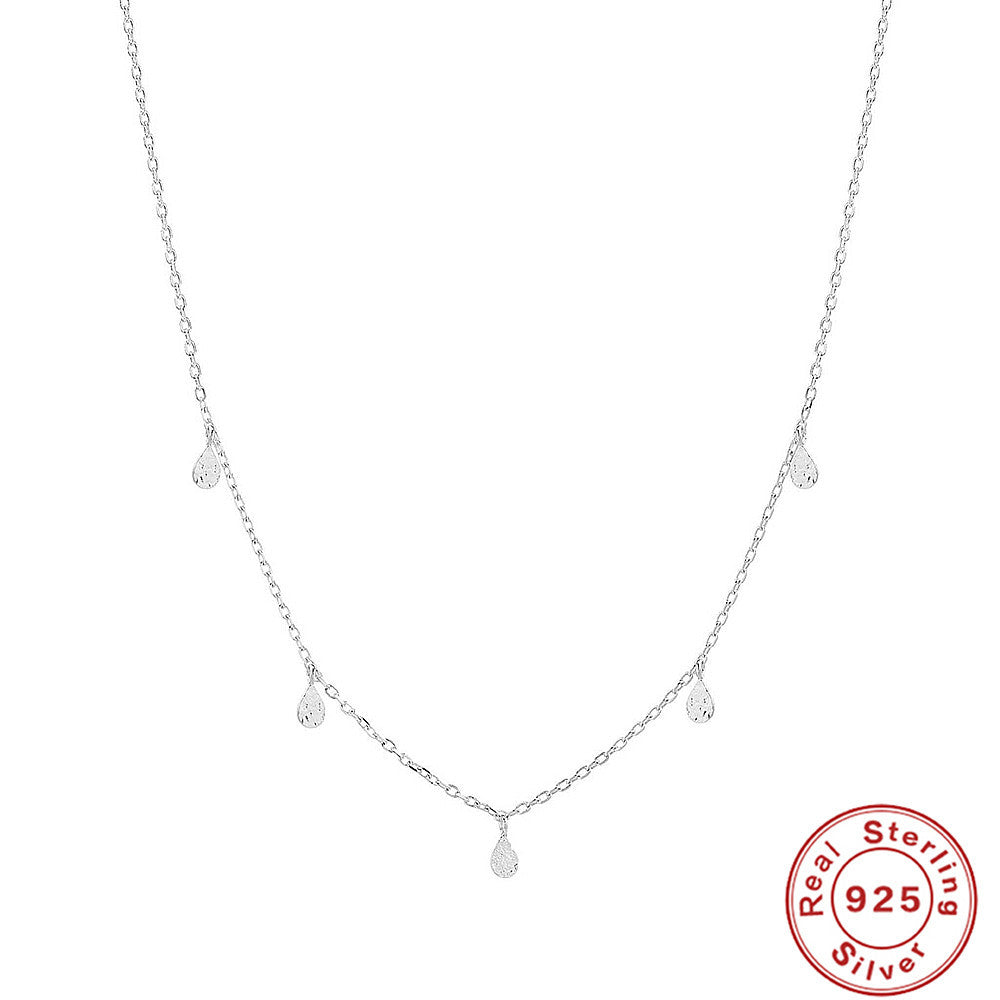Silver necklace with teardrop-shaped pendants on a white background, featuring a 'Real Sterling 925' stamp.