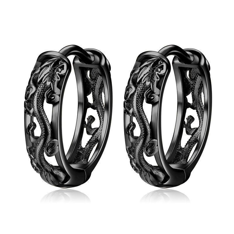 Pair of black hoop earrings with intricate designs on a white background