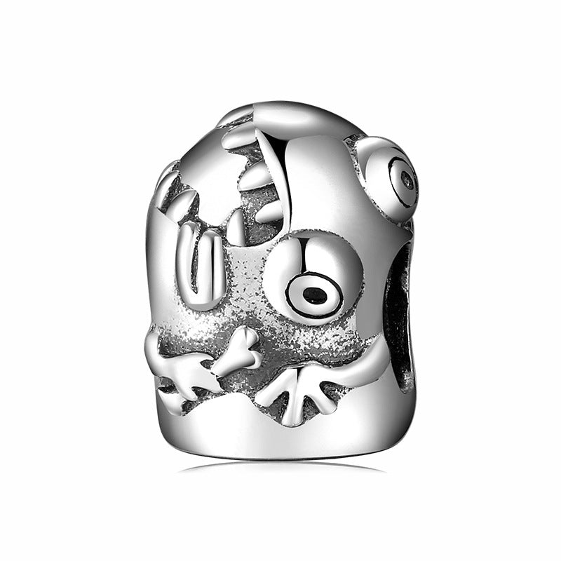Silver charm with a detailed design on a white background