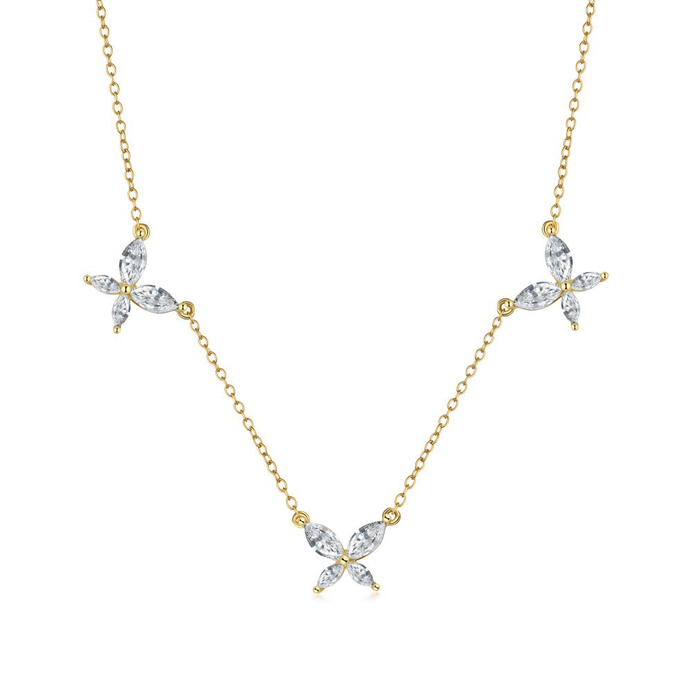 Gold necklace with butterfly-shaped diamond pendants on a white background