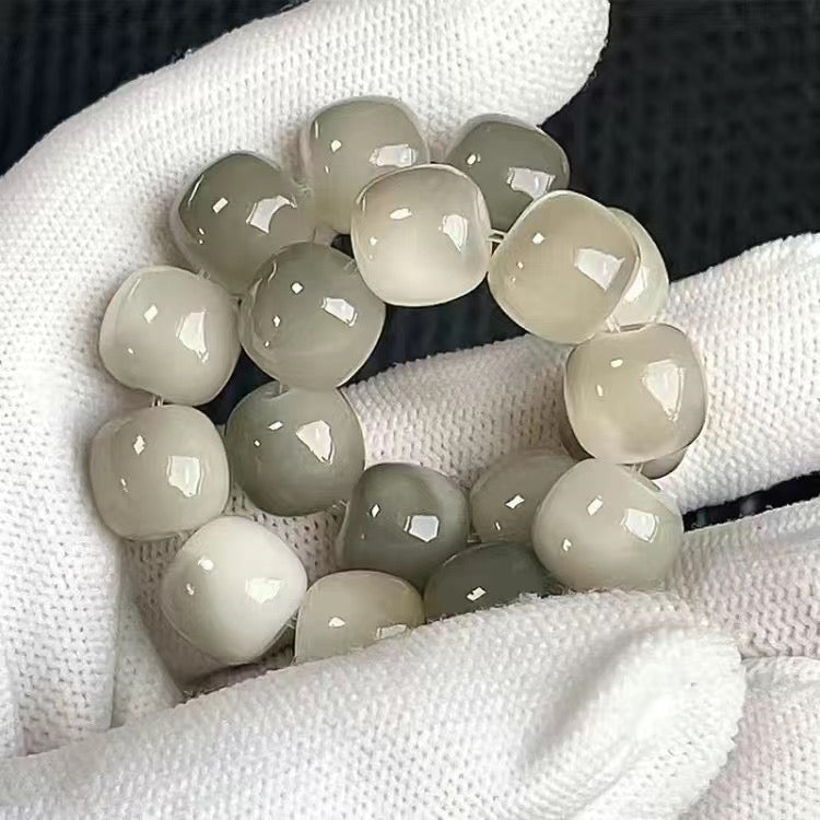 White jade bracelet on a white cloth background