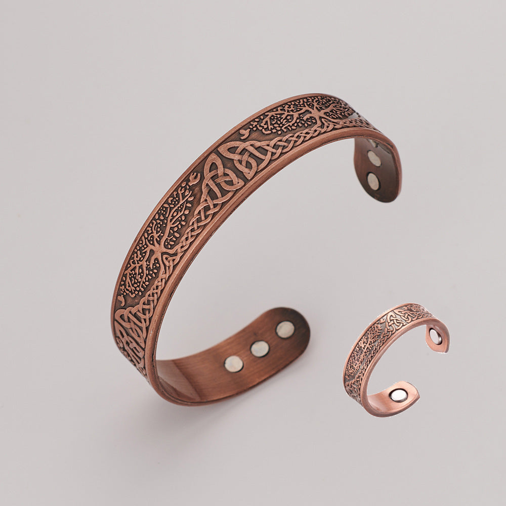Decorative copper bracelet on a light gray background