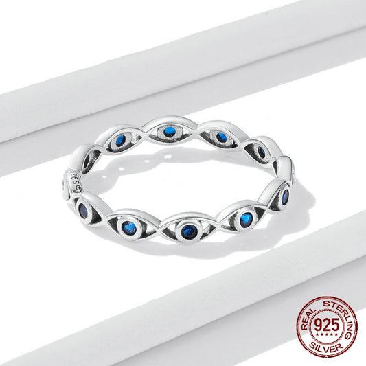 Silver ring with blue gemstones on a white background, featuring a 'Real 925 Sterling Silver' stamp.