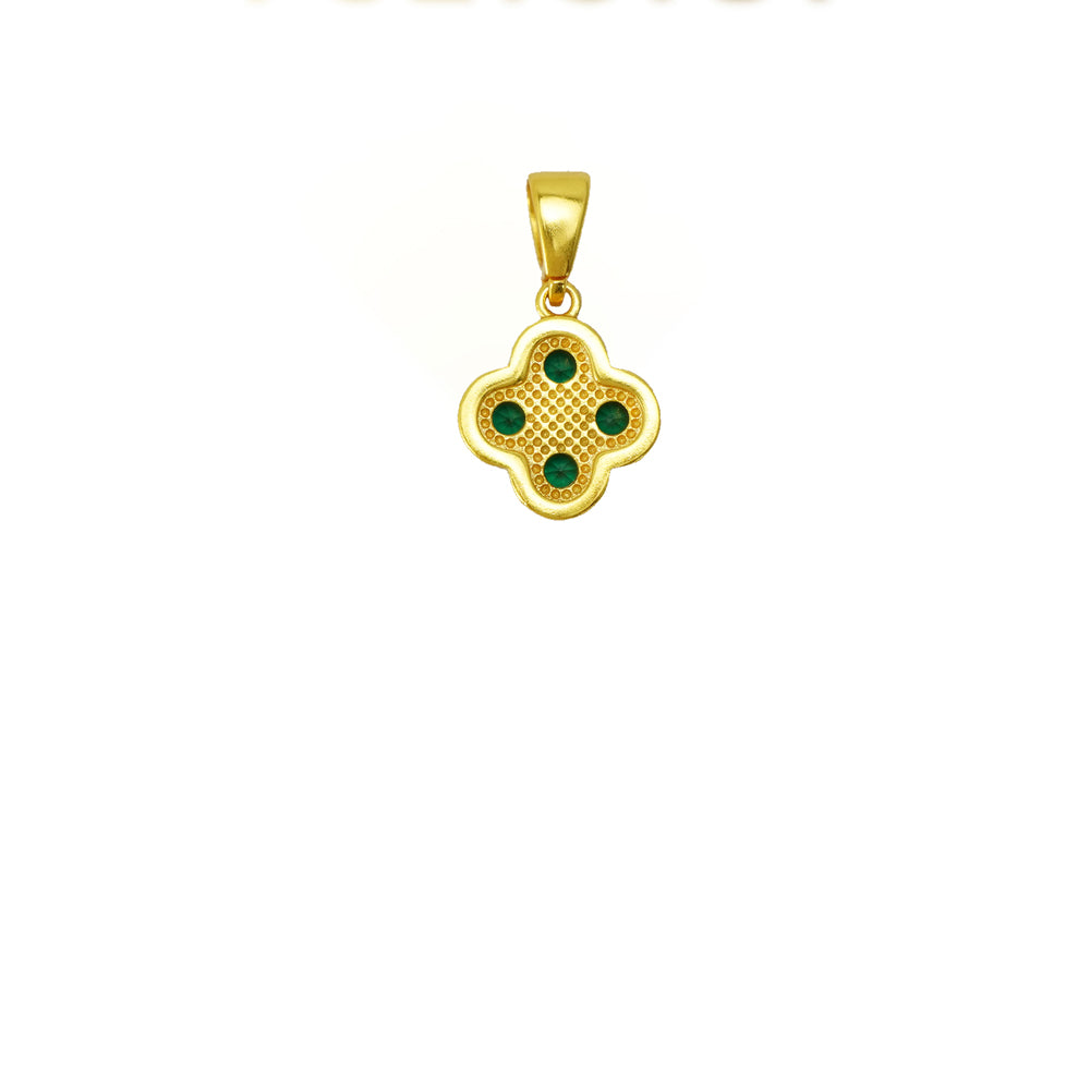 Gold pendant with green gemstones on a white background