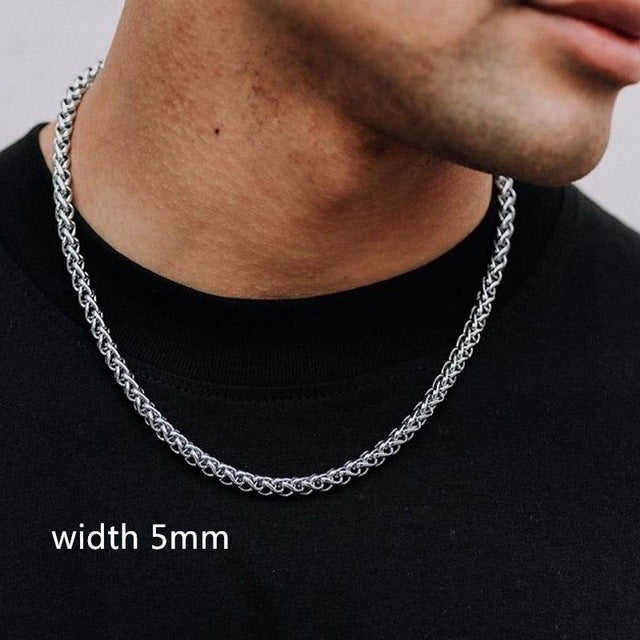 Silver chain necklace worn by a person on a black background with 'width 5mm' text.