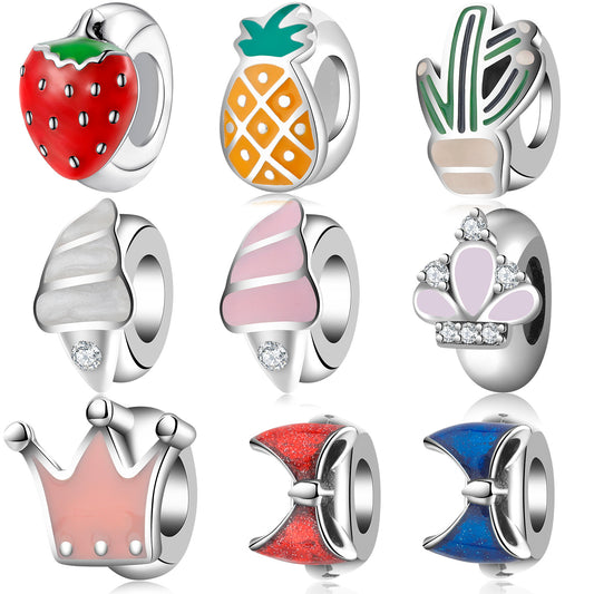 Set of colorful charm beads on a white background