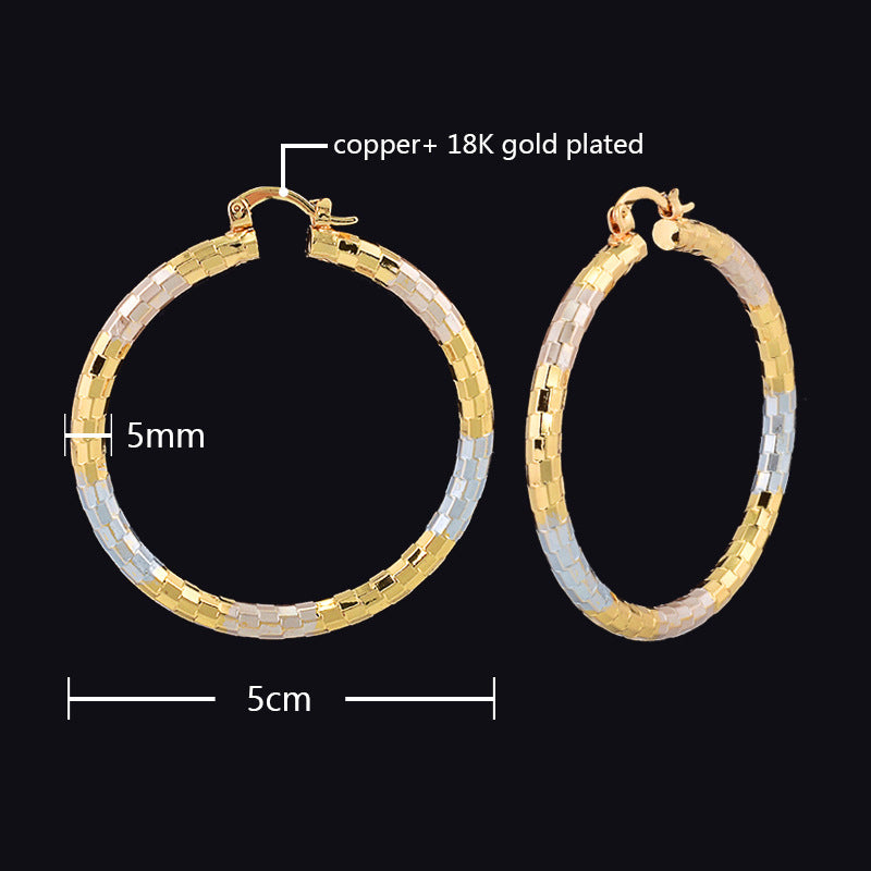 Gold and silver hoop earrings with measurements on a black background
